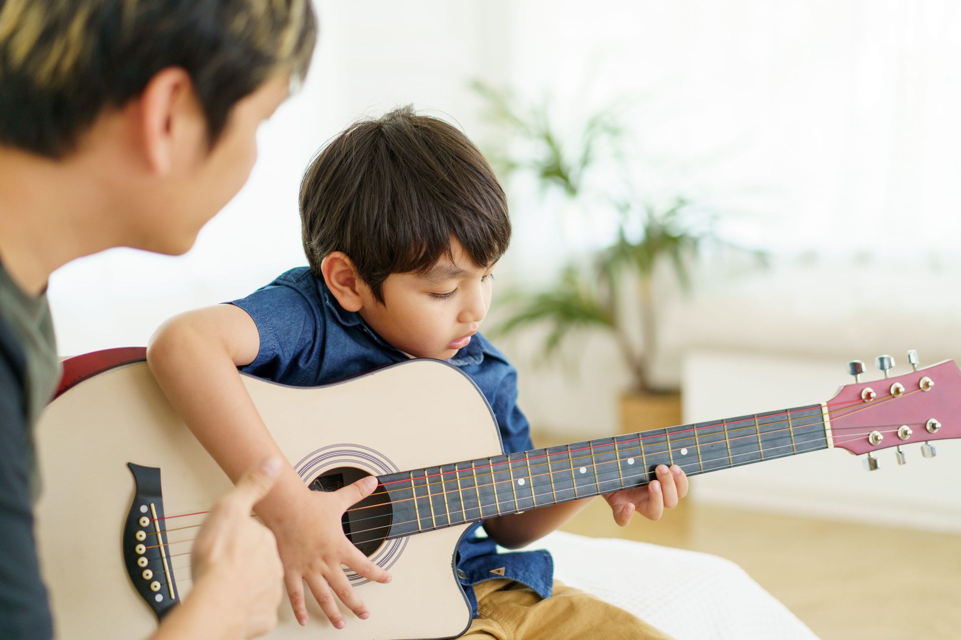 Child playing guitar.