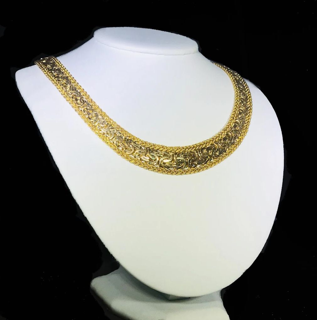 14k gold necklace elegantly displayed on jewelry stand at Marcelo’s Jewelry