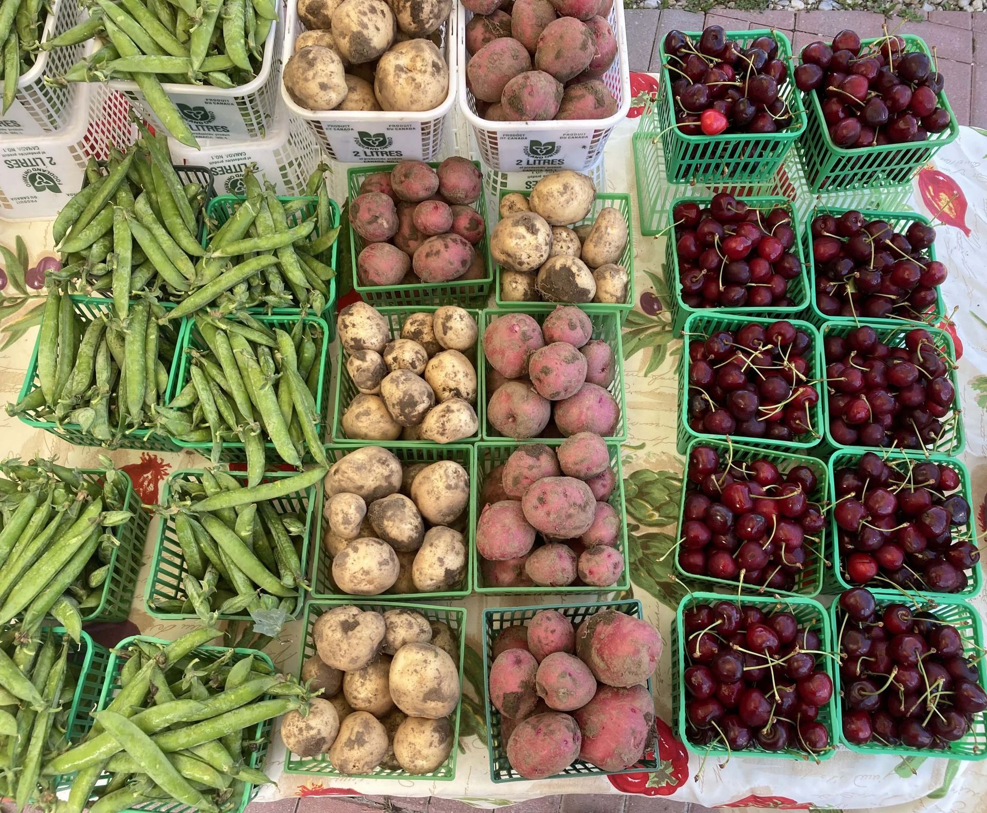 There are many different types of fruits and vegetables on the table.