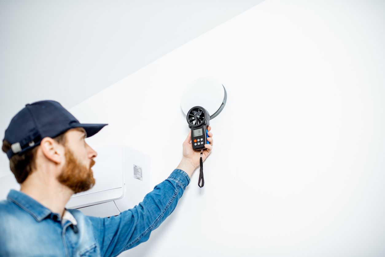 Seattle homeowner using HVAC ventilation and ceiling fans to improve indoor air quality and comfort.
