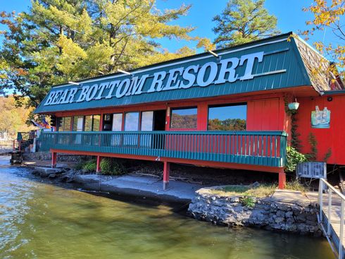 The bear bottom resort is located on the shore of a lake.