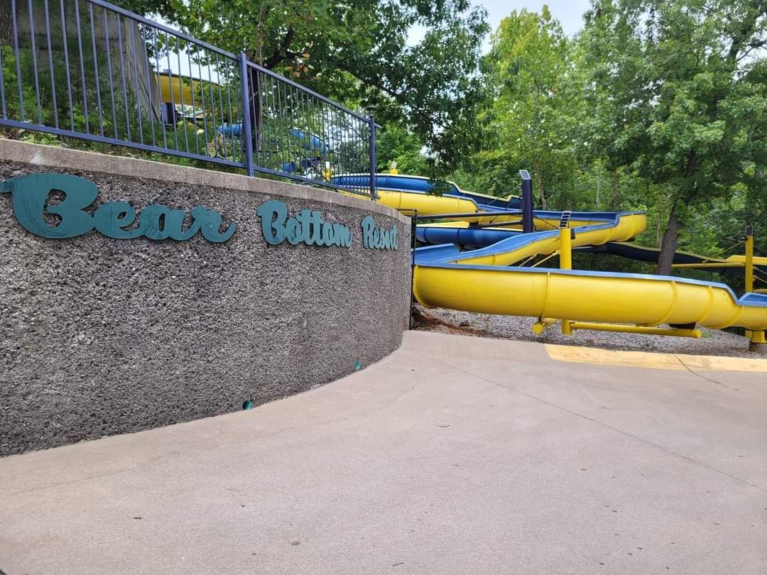 A water park with a sign that says ' bears bath ' on it