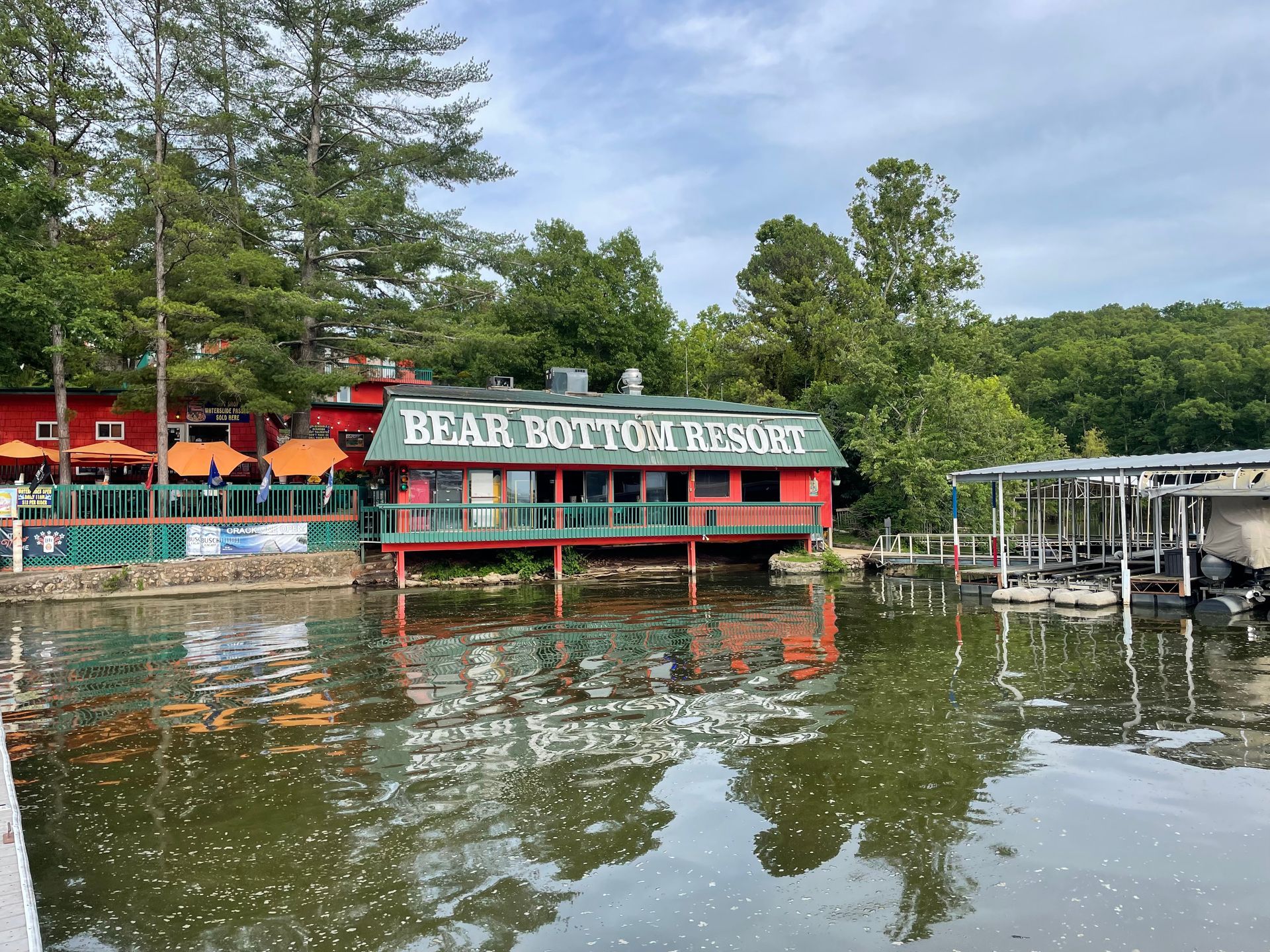 The bear bottom resort is located on the shore of a lake.