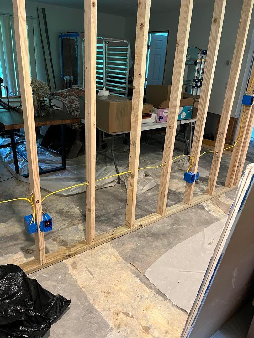 A room is being remodeled and a wooden wall is being built.