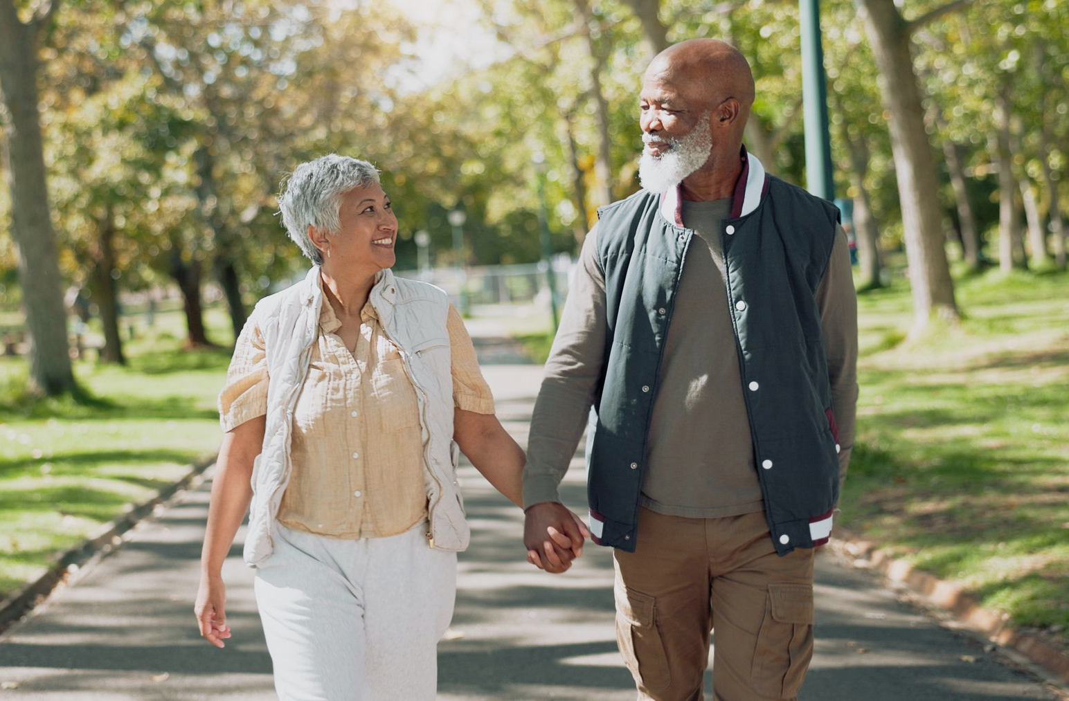 Two beagle dogs are sitting in the back of a vehicle.