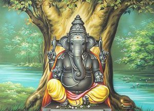 Ganesha statue seated beneath a tree, hands raised, yellow and red clothing.