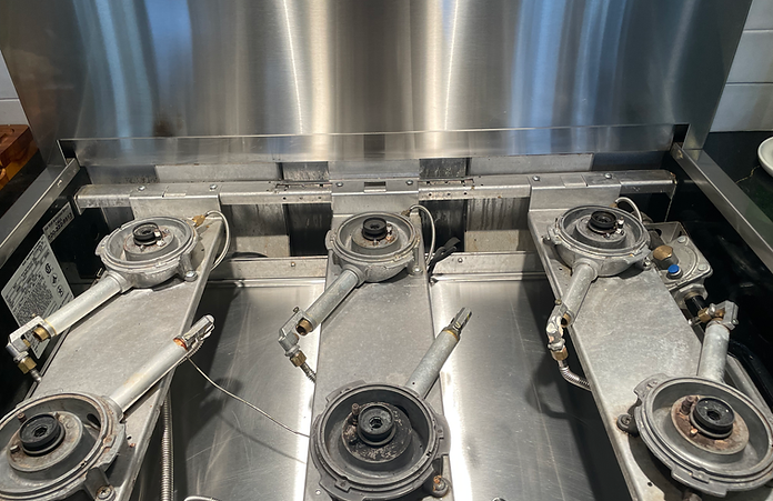 A stainless steel stove with three burners on it.