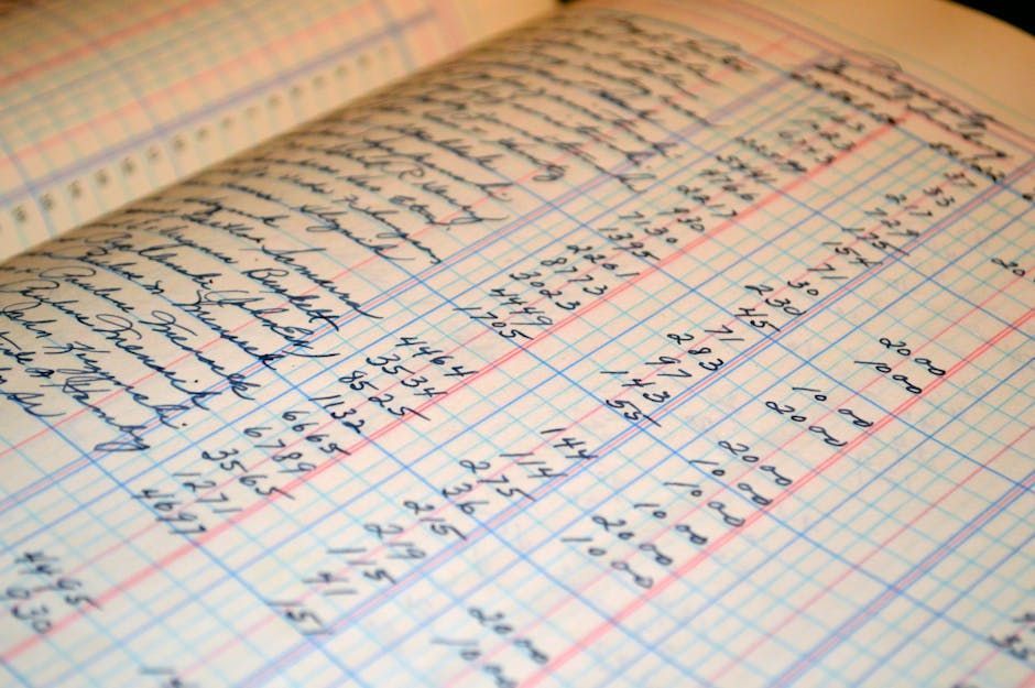 Open ledger book with handwritten financial entries in blue ink on gridded paper.
