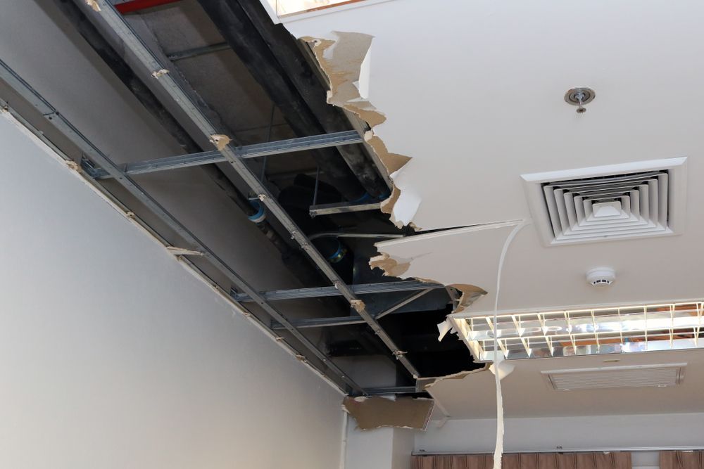 A Room With a Ceiling That Has a Hole in It — Knobel Builders In Balgownie, NSW