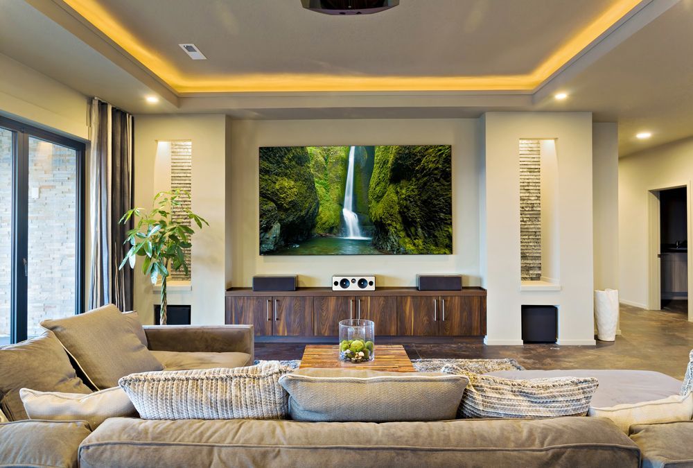 A Living Room With a Large Picture of a Waterfall on the Wall — Knobel Builders In Balgownie, NSW