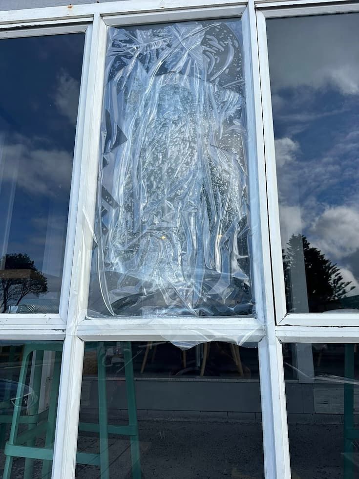 A Windowpane Covered With Crinkled Plastic