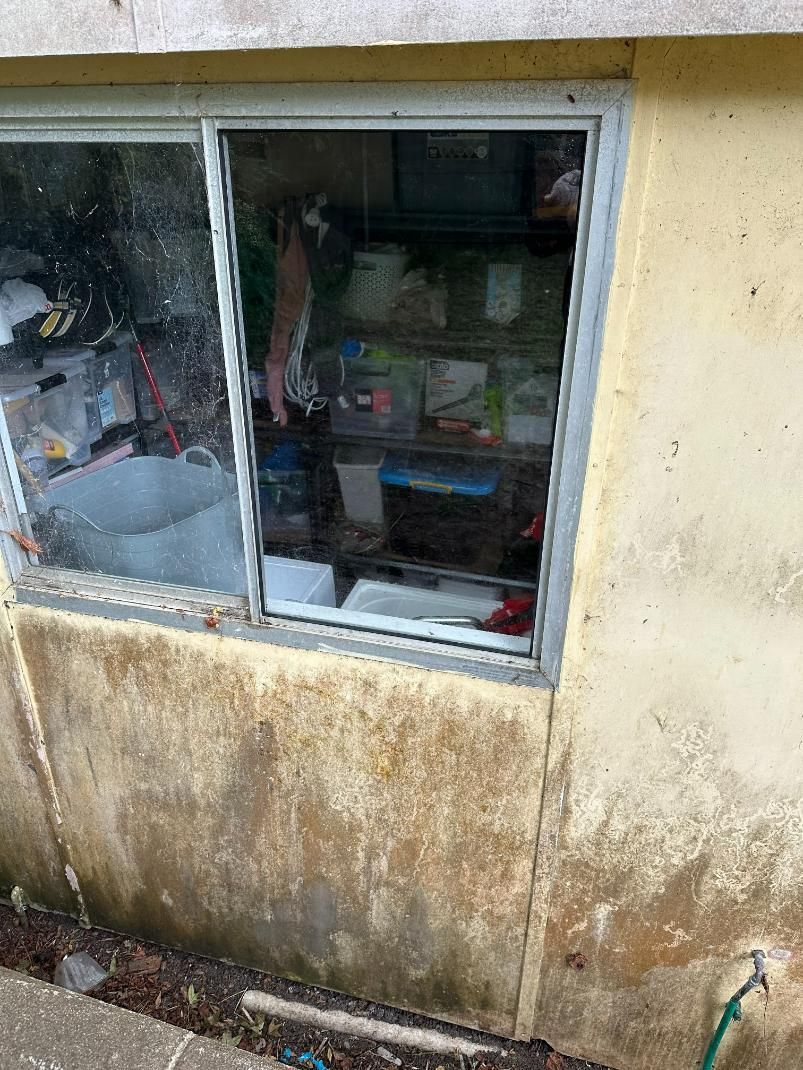 A Window On The Side Of A Building With A Broken Glass Window — Central Coast Glass & Glazing In Erina, NSW