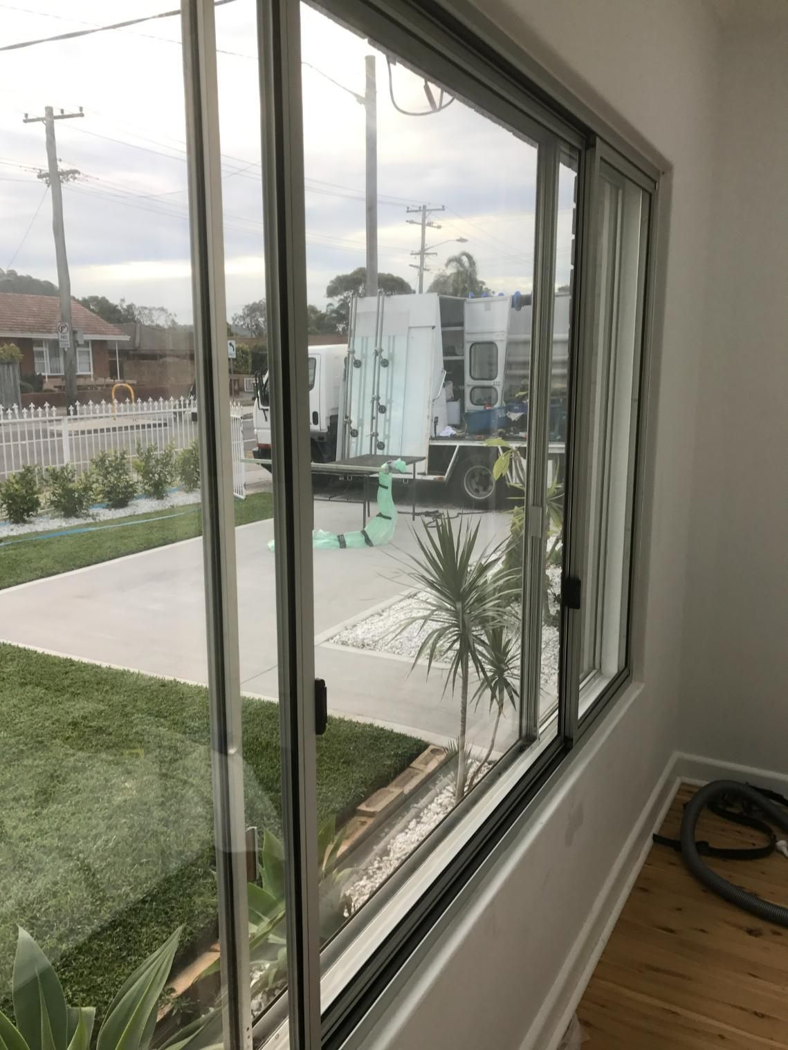 A Large Window In A Room With A View Of A Street — Central Coast Glass & Glazing In Umina Beach, NSW