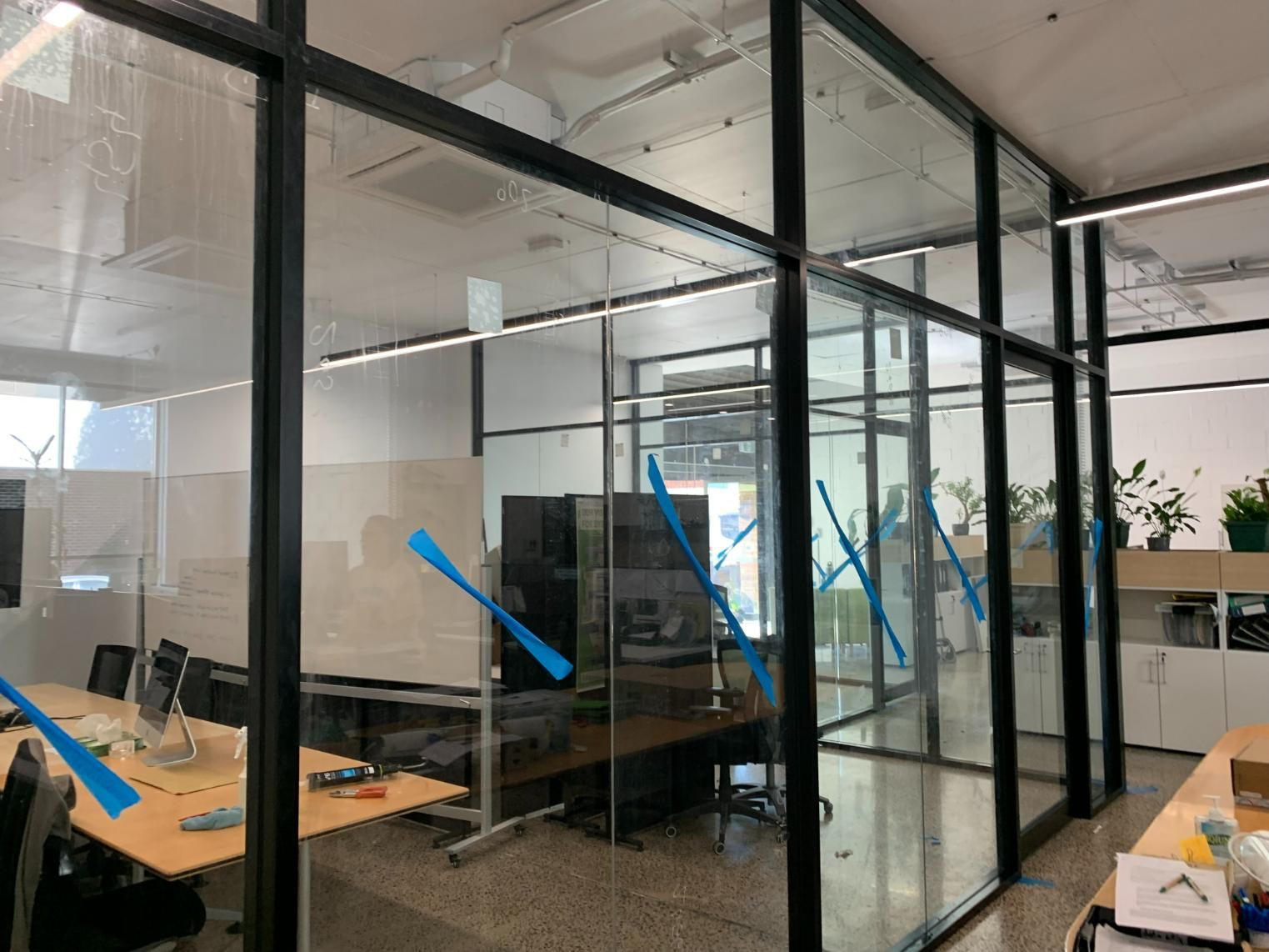 A Room With A Table And Chairs In It And A Glass Wall — Central Coast Glass & Glazing In Umina Beach, NSW