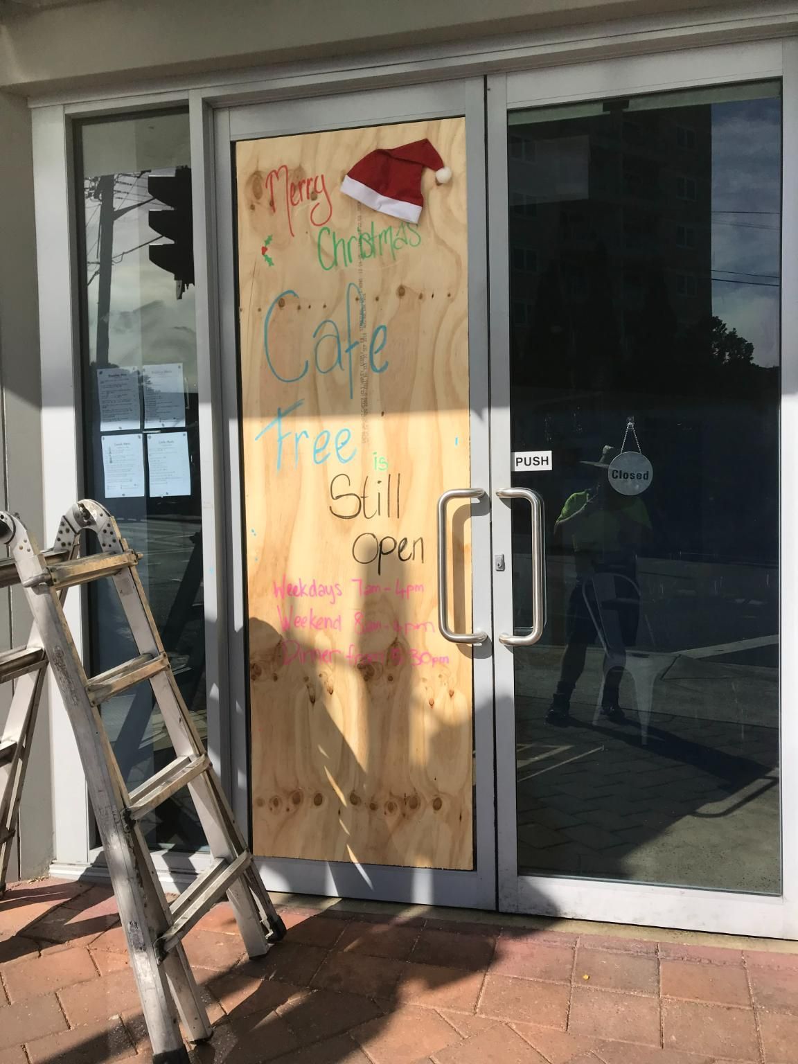 A Door Is Being Boarded Up — Central Coast Glass & Glazing In Umina Beach, NSW
