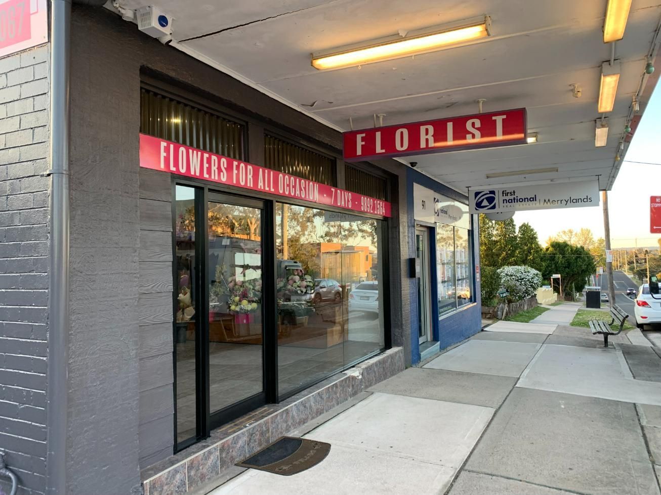 A Florist Shop Is Located On The Side Of A Street — Central Coast Glass & Glazing In Umina Beach, NSW