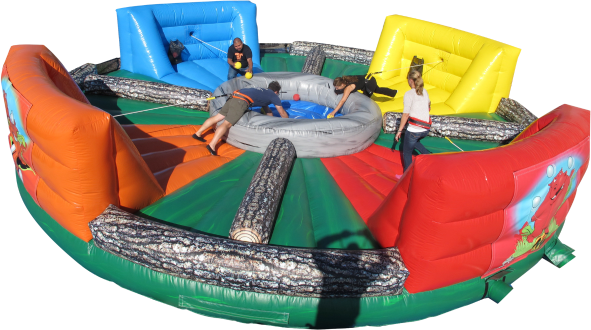 Four people compete in a multi-colored, circular inflatable arena, reaching toward a center pit to collect balls.