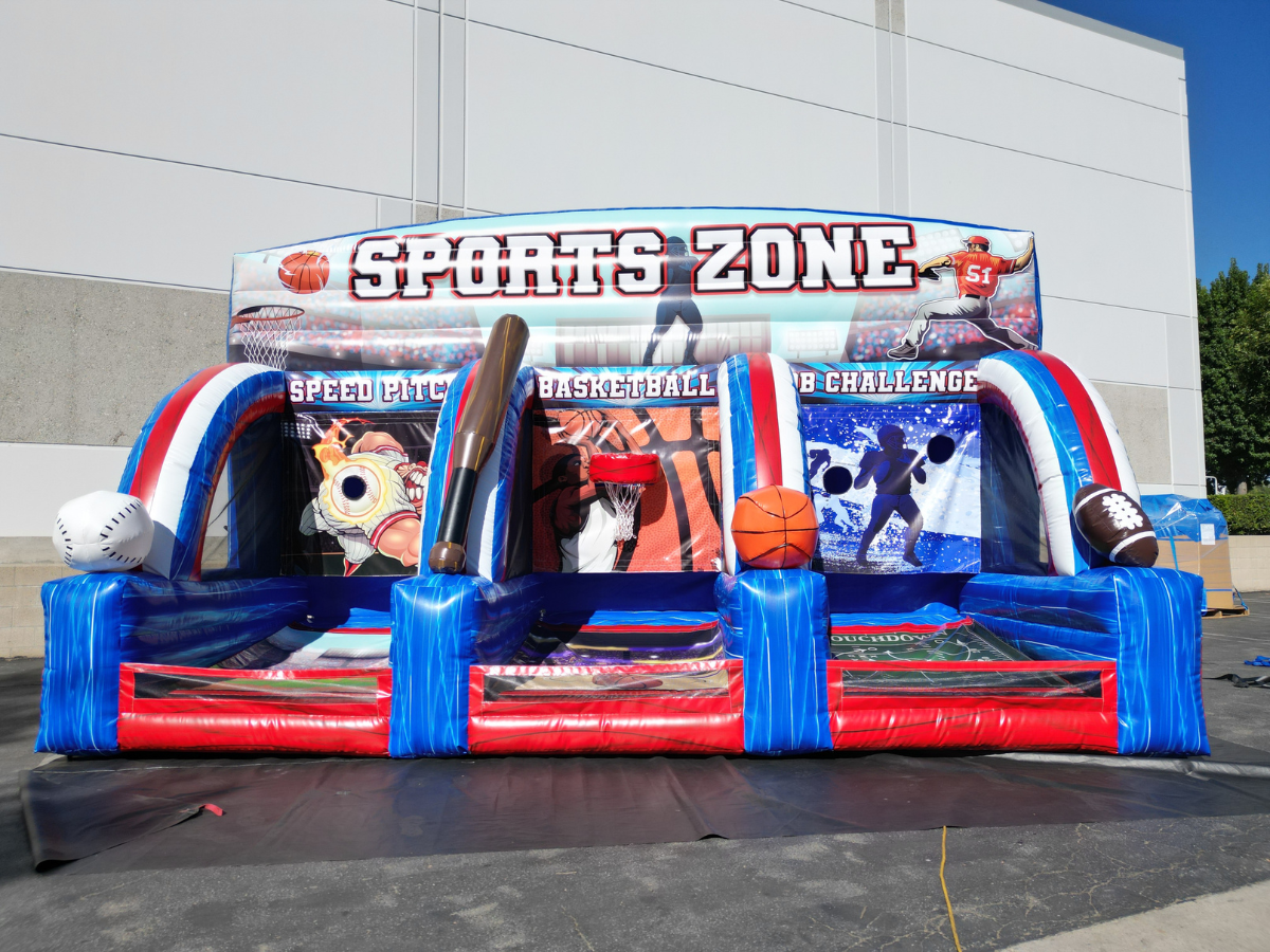 Inflatable Sports Zone game featuring baseball, basketball, and football stations with blue, white, and red accents.