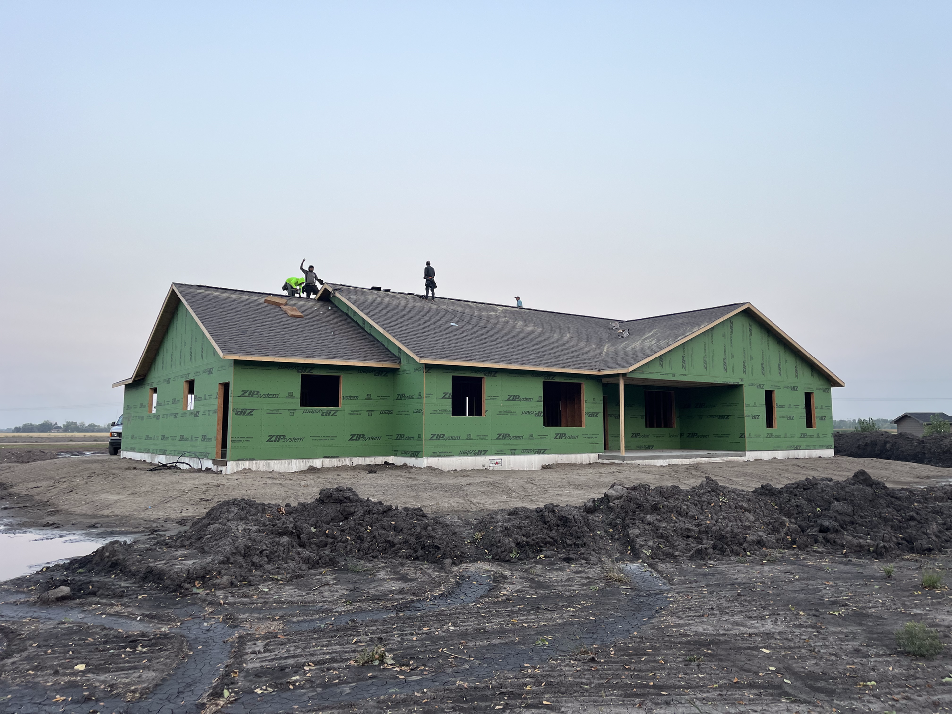 Installing shingles on a new home build