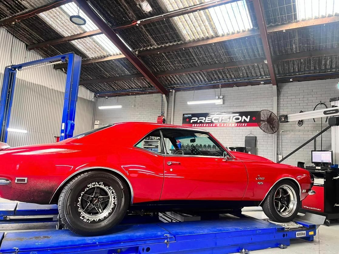 Camaro SS Car On A Lift In The Garage — Mechanic in Wollongong, NSW