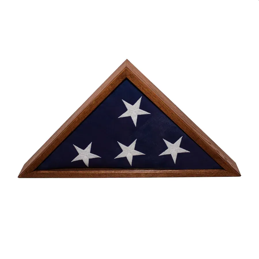 Triangular wooden case displaying folded US flag, blue field with three white stars.