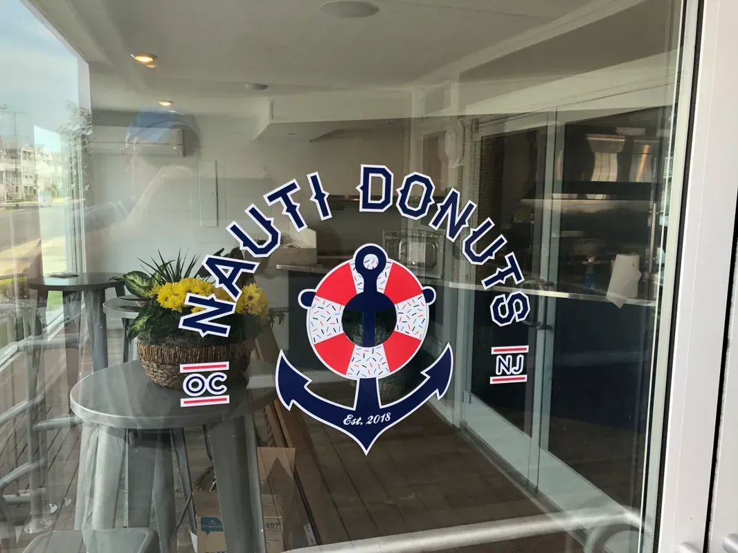 A glass door with a nautica donut logo on it in Bridgeton, NJ.