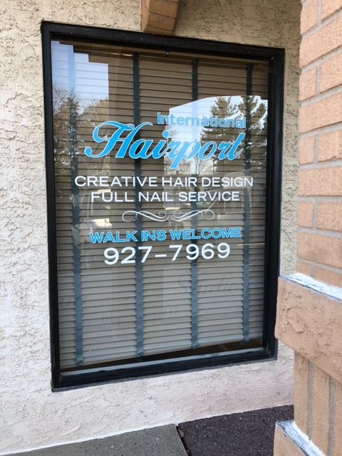 A sign for hairport creative hair design full nail service in Somers Point, NJ.