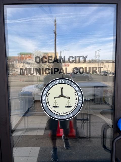 A person is walking into the ocean city municipal court in Hammonton, NJ
