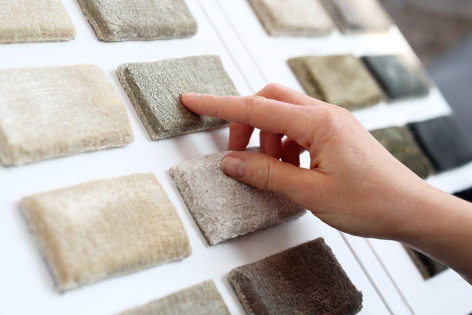 customer choosing a carpet swatch