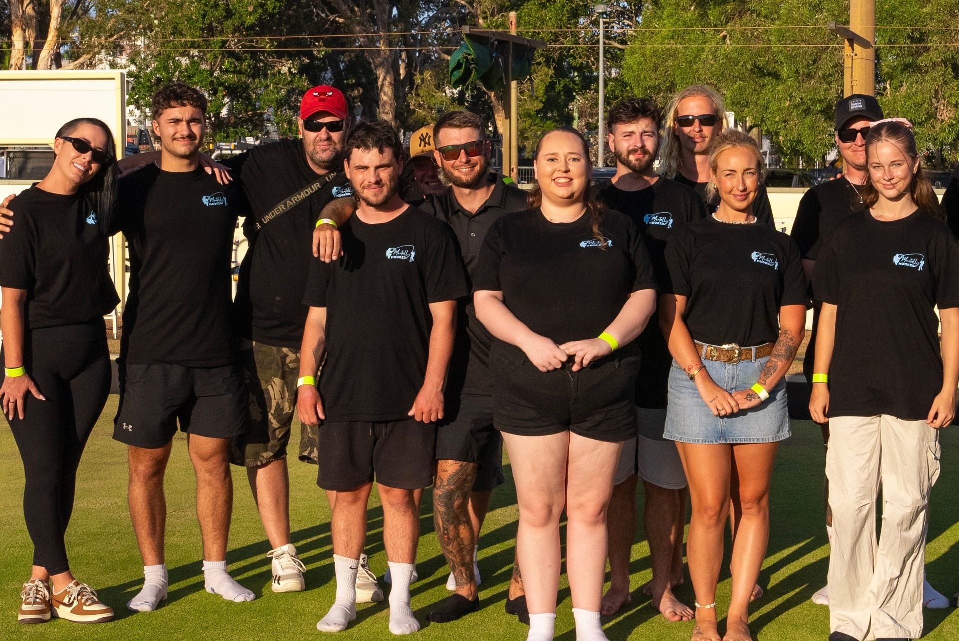 A Group of People Are Sitting at a Table With Plates of Food — Mentally Hooked in Helensvale, QLD