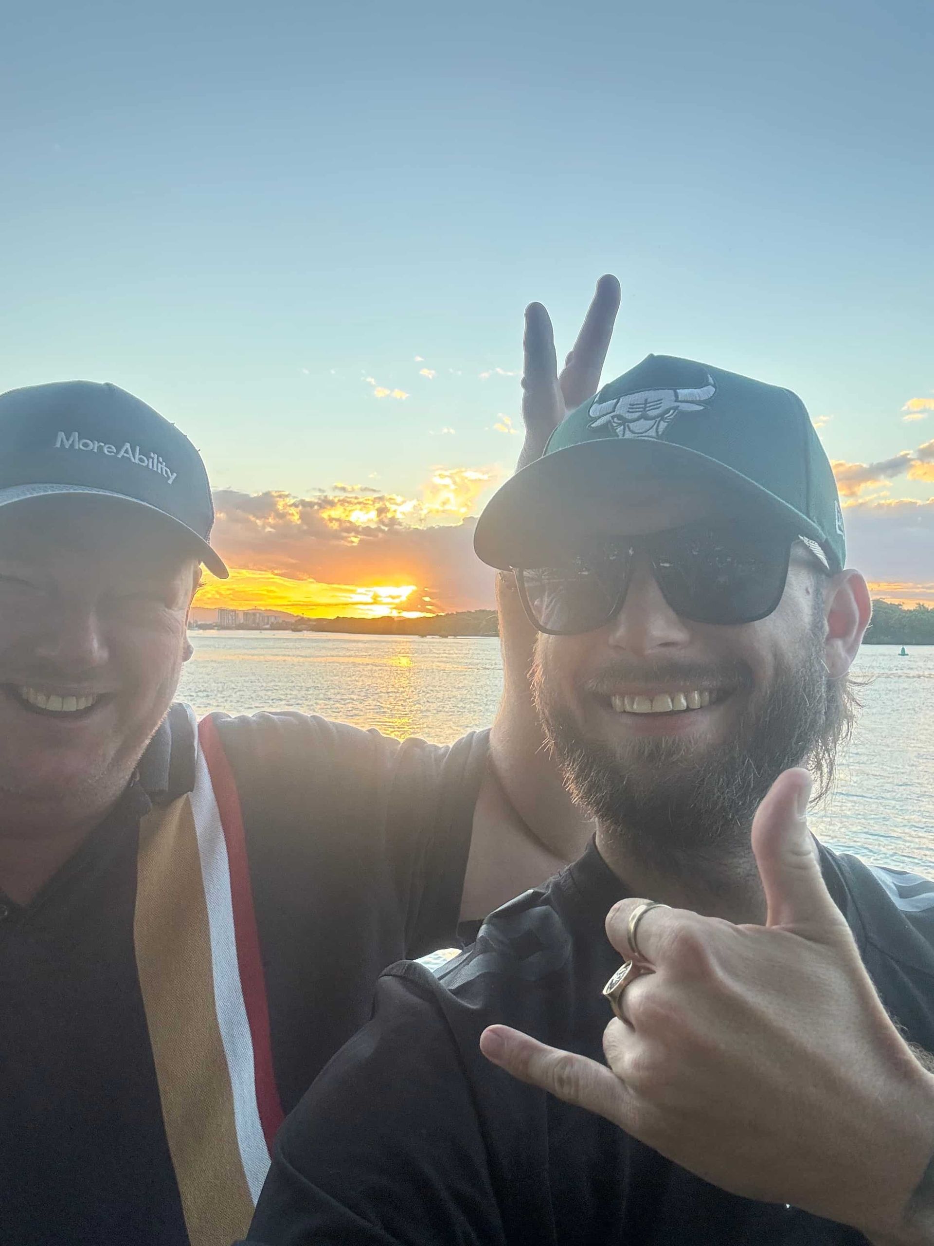 Two Men Are Posing for a Picture in Front of a Body of Water — Mentally Hooked in Robina, QLD