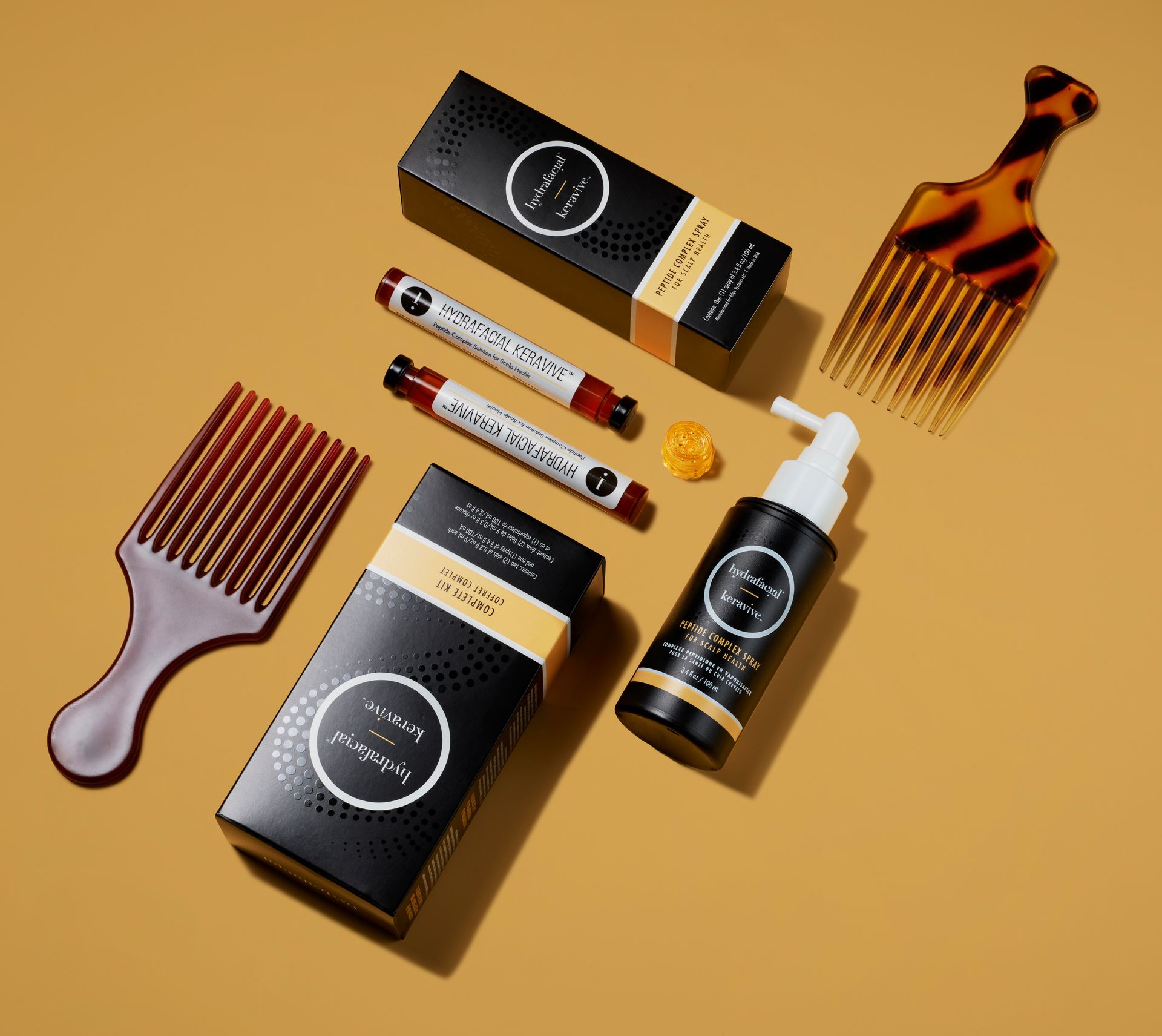 A collection of hair products including a comb and a bottle