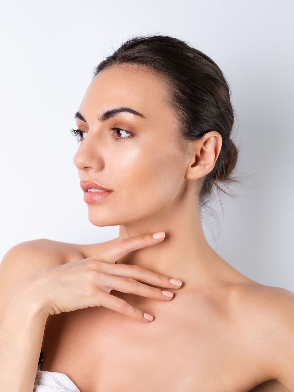 a woman touching her neck