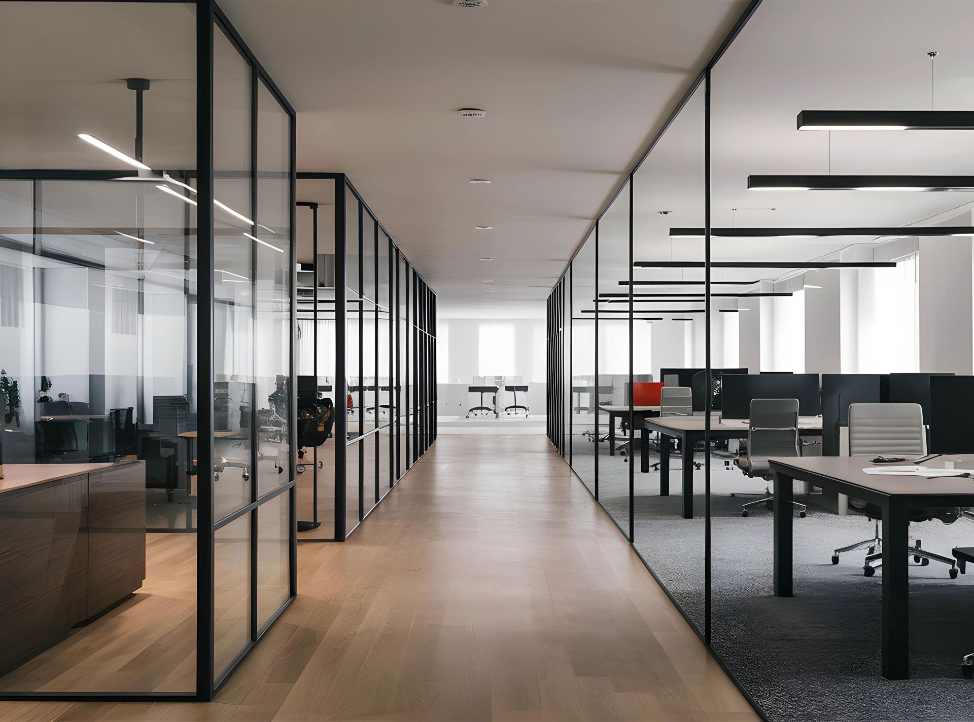 A long hallway in an office building with tables and chairs.