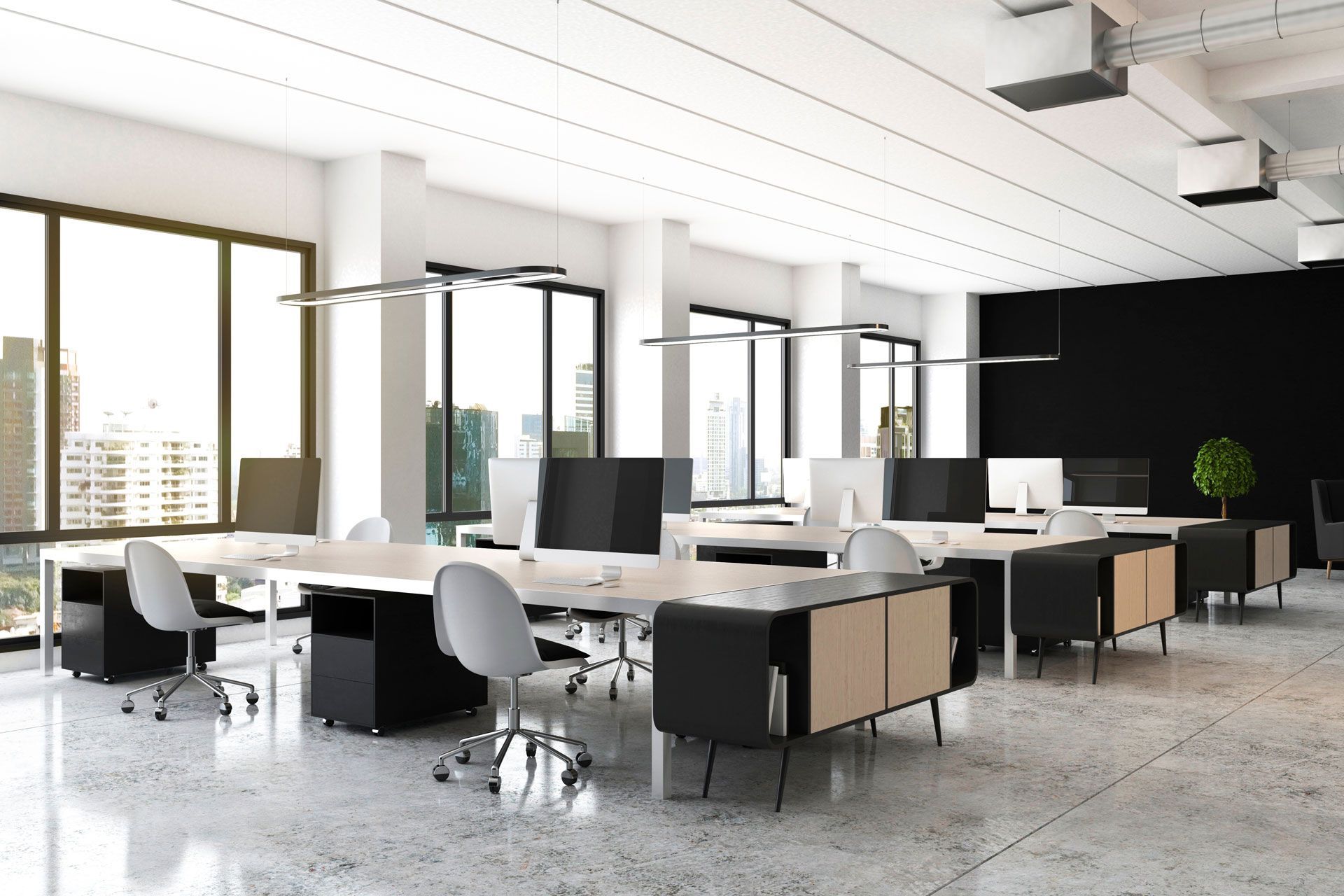 An empty office with a lot of windows and tables and chairs.