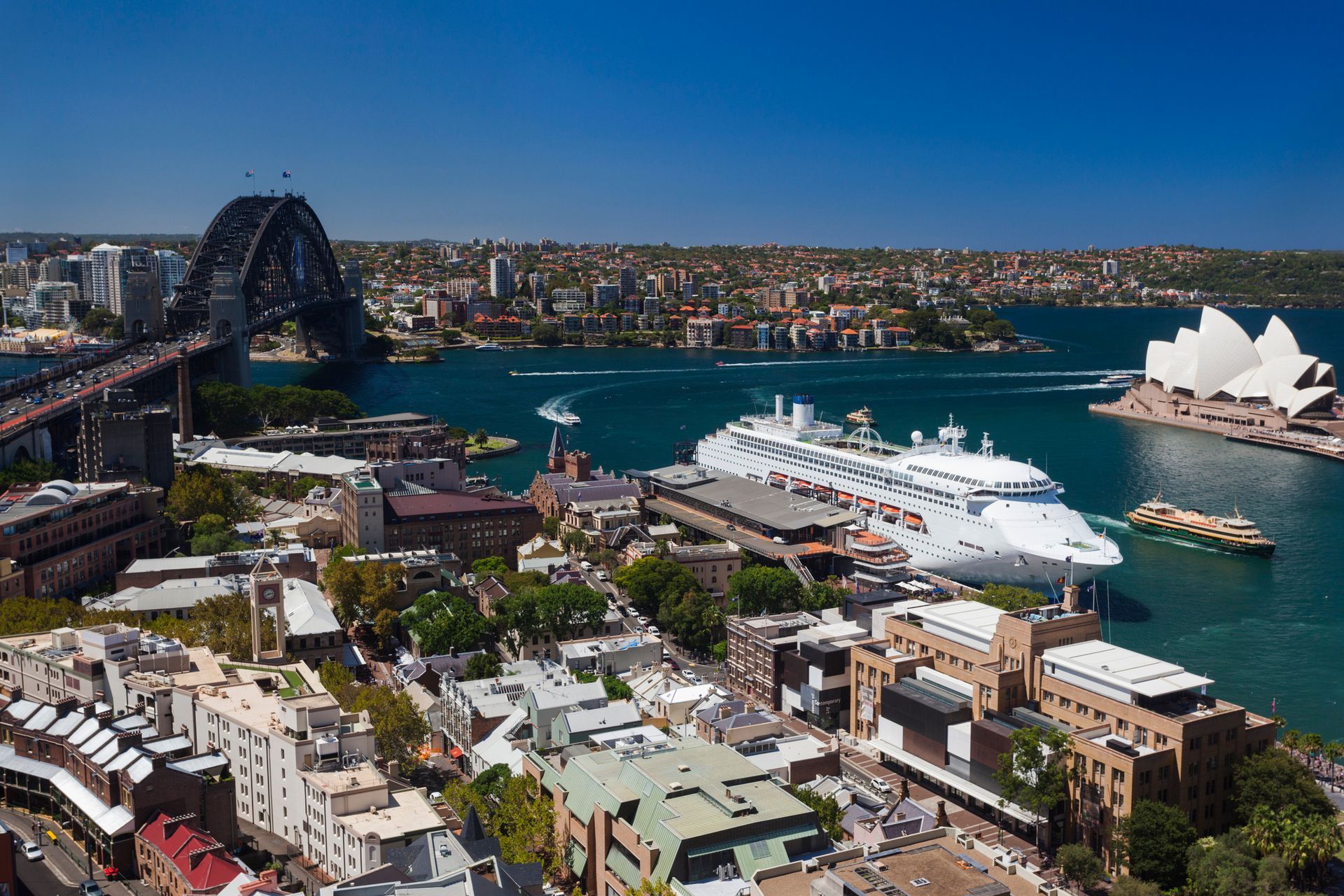 An aerial view of sydney harbor and the opera house
