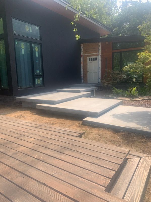 A large house with a fence around it and a large porch.