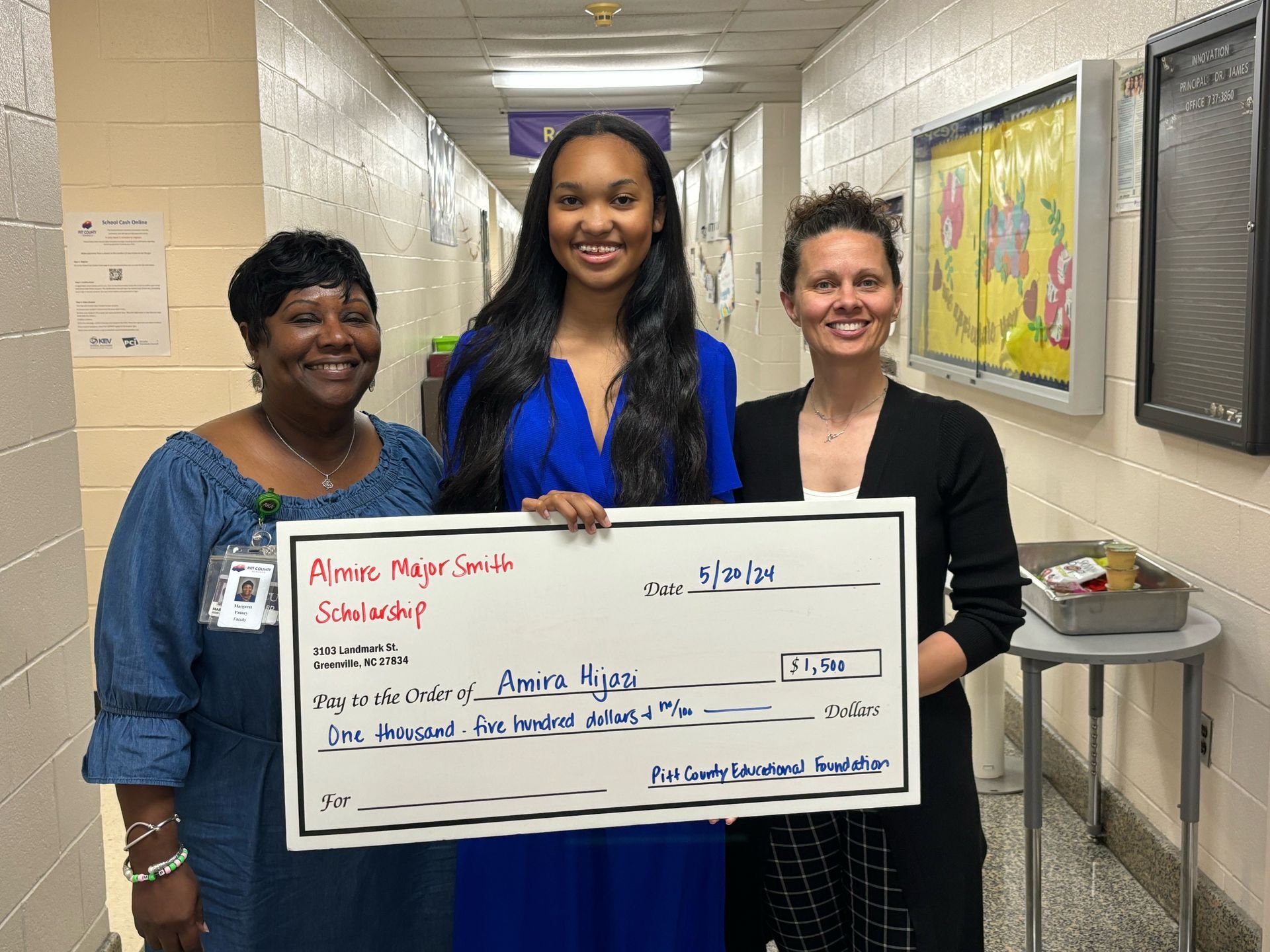 student accepting scholarship