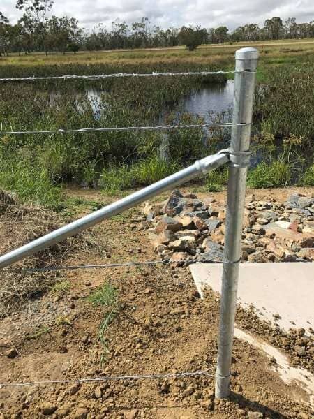 A Close Up Of A Metal Fence With A River In The Background — Mulch, Fencing And Landscaping Mackay, QLD