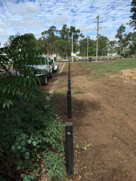 A Truck Is Parked Next To A Fence In A Field — Mulch, Fencing And Landscaping Mackay, QLD