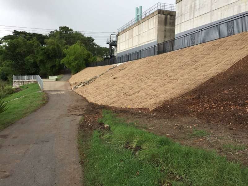 A Dirt Road Next To A Building — Garden Maintenance And Mini Digger Hire In Mackay And Surrounds, QLD