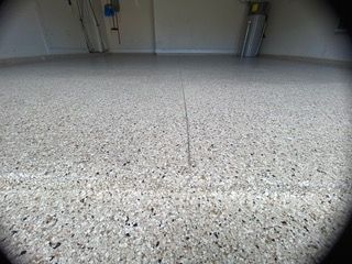 A close up of a concrete floor in a garage.