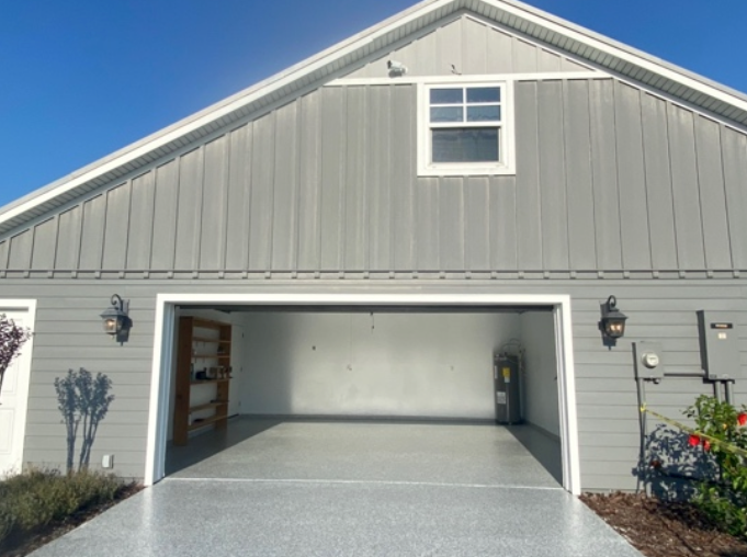 A garage with the door open and a window