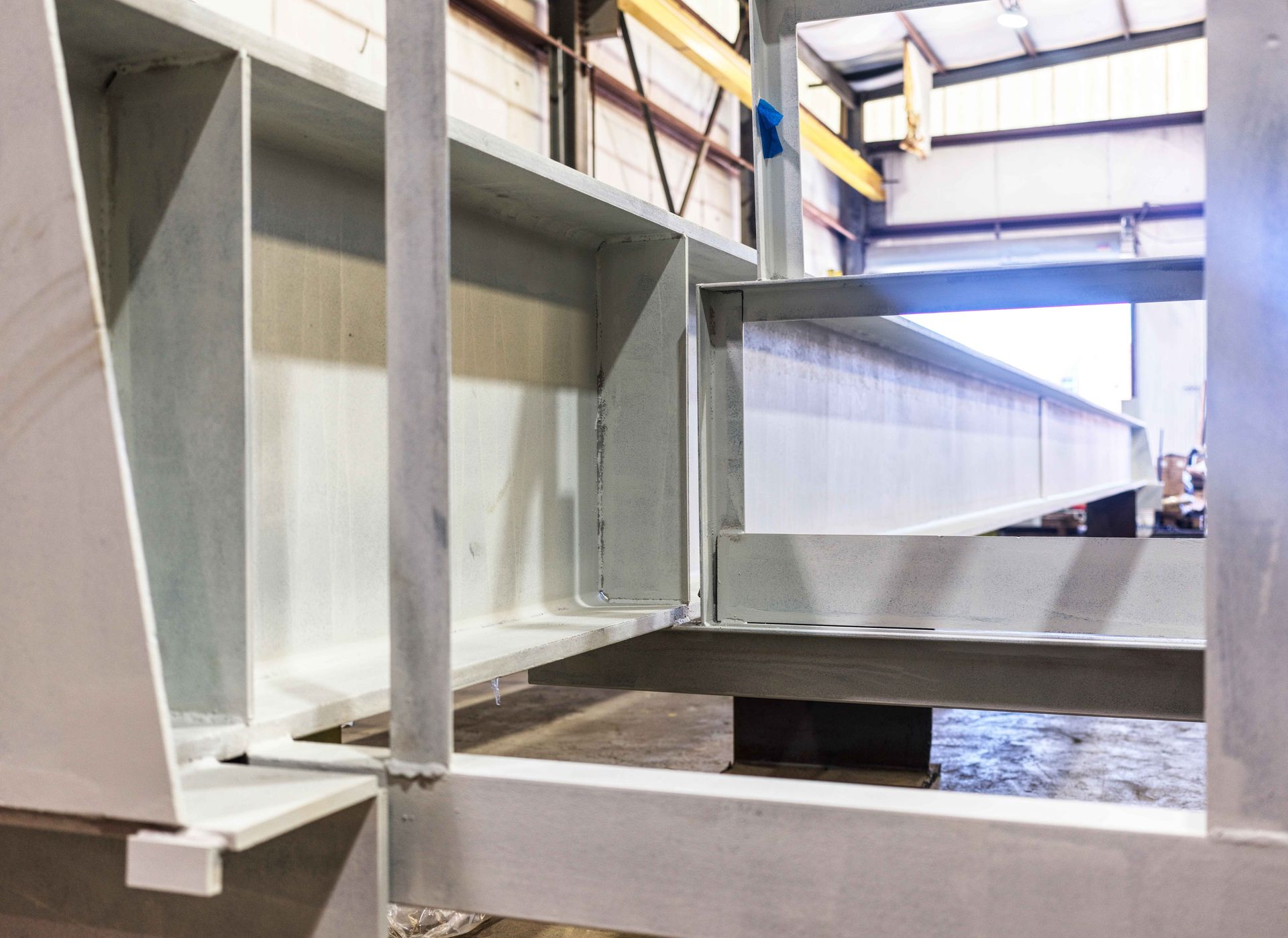 A large metal structure is sitting inside of a building.