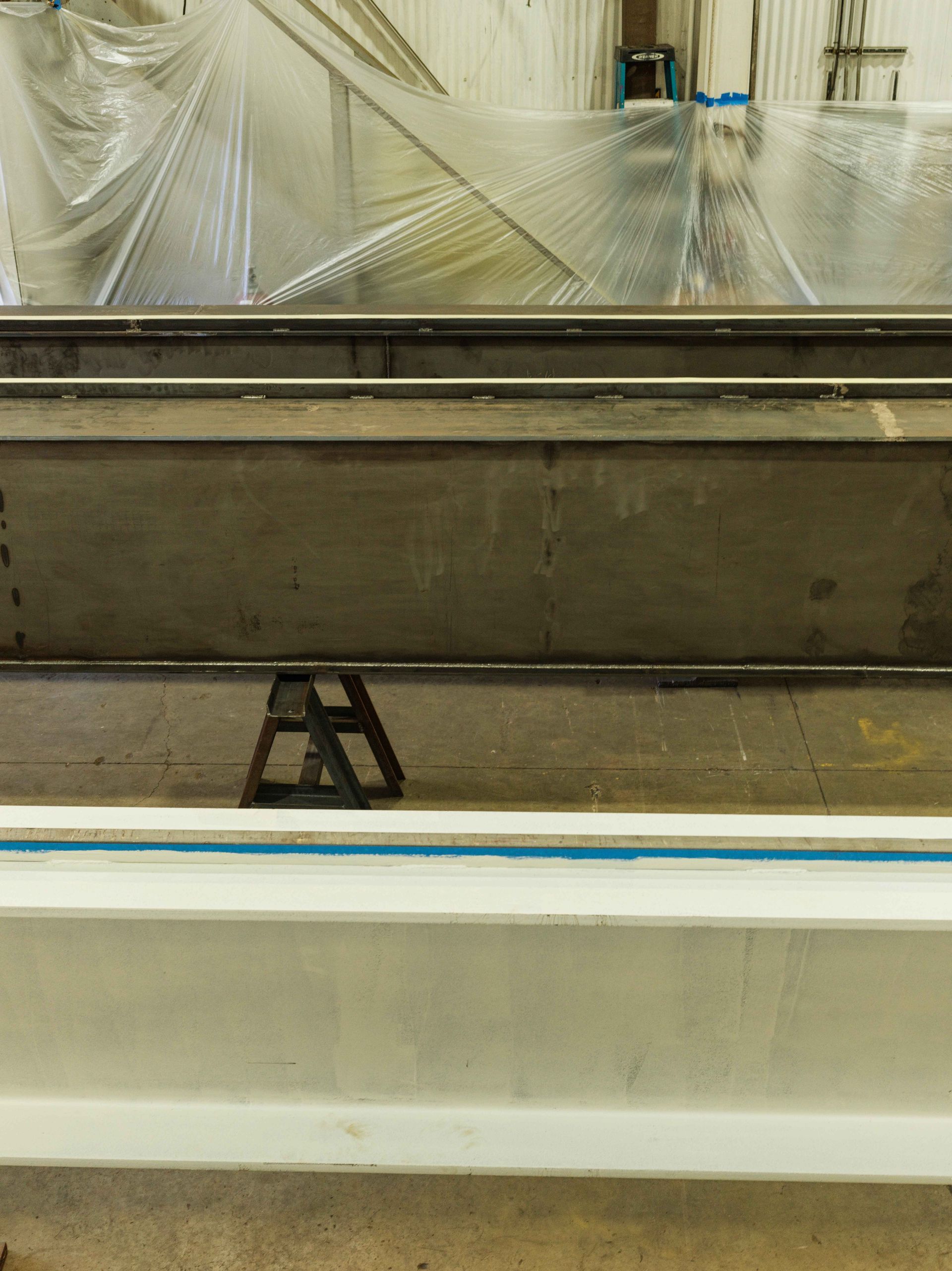 A large piece of metal is sitting on a table in a room.