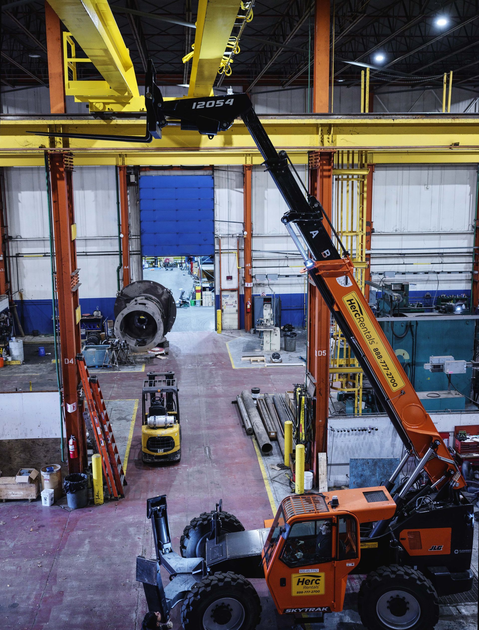 A forklift with a license plate that says wj7