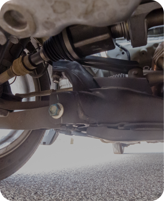 A close up of the underside of a car 's suspension system. | Japanese Car Care