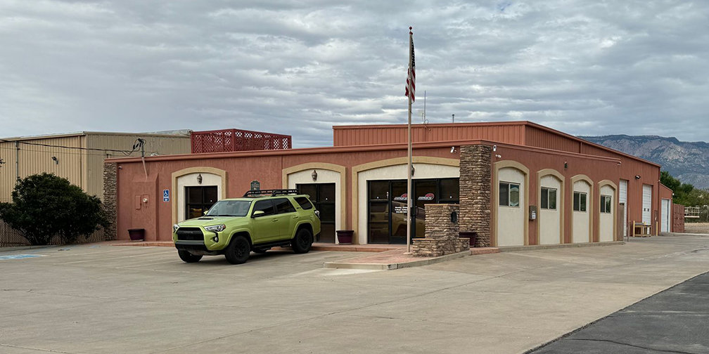 A Green car parked at our facility - Japanese Car Care