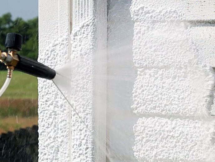 hose cleaning exterior of house