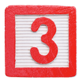 Red wooden block with the number 3.